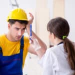 Doctor helping injured worker at construction site